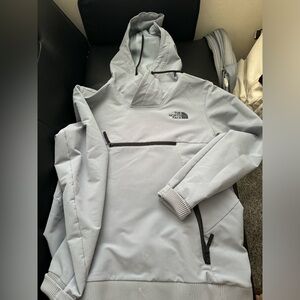 grey north face windbreaker